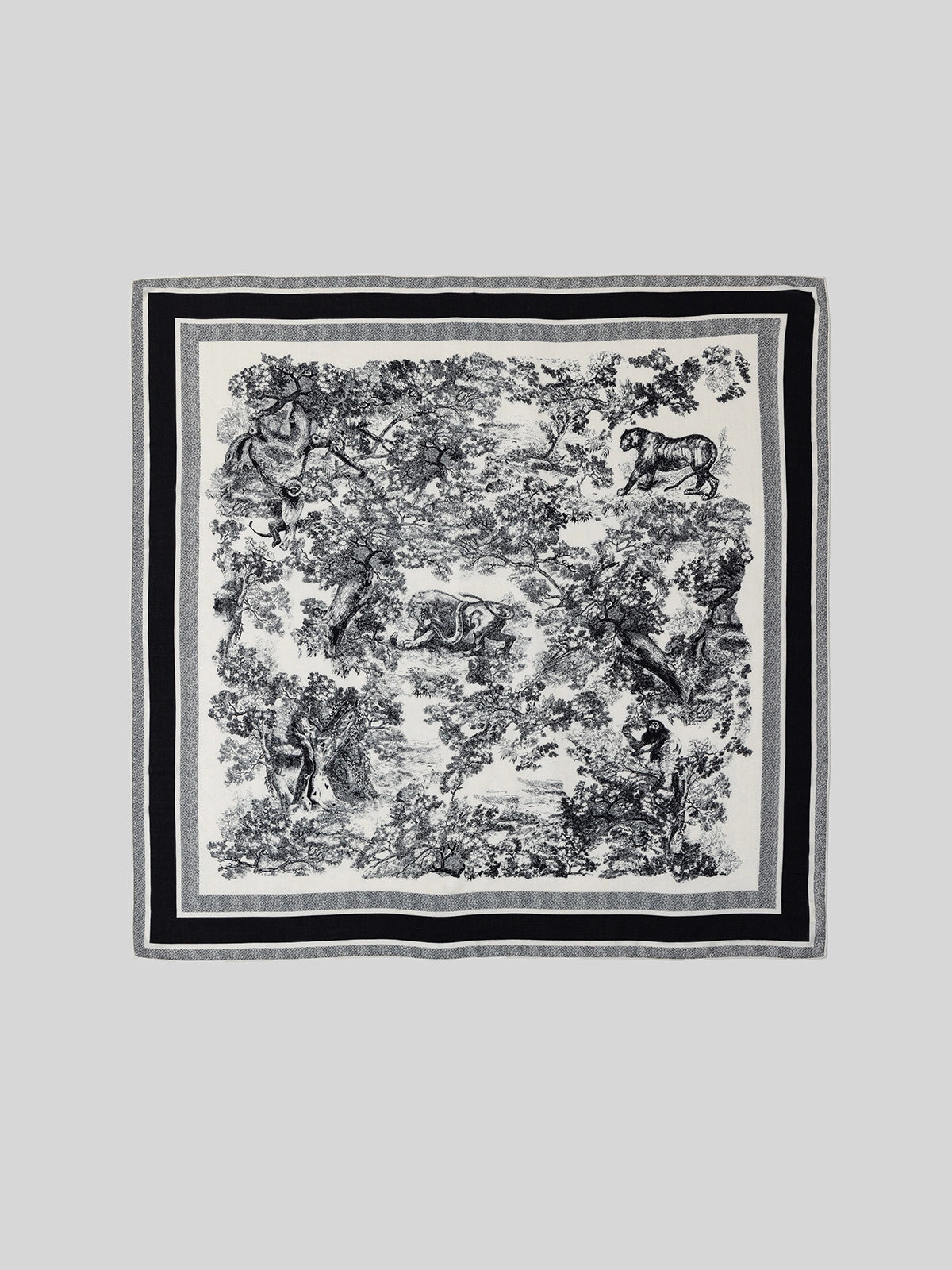 Luxurious black silk wool scarf, 130 x 130 cm, displays a distinctive animal jungle print when laid flat—the perfect choice for elegant winter style.