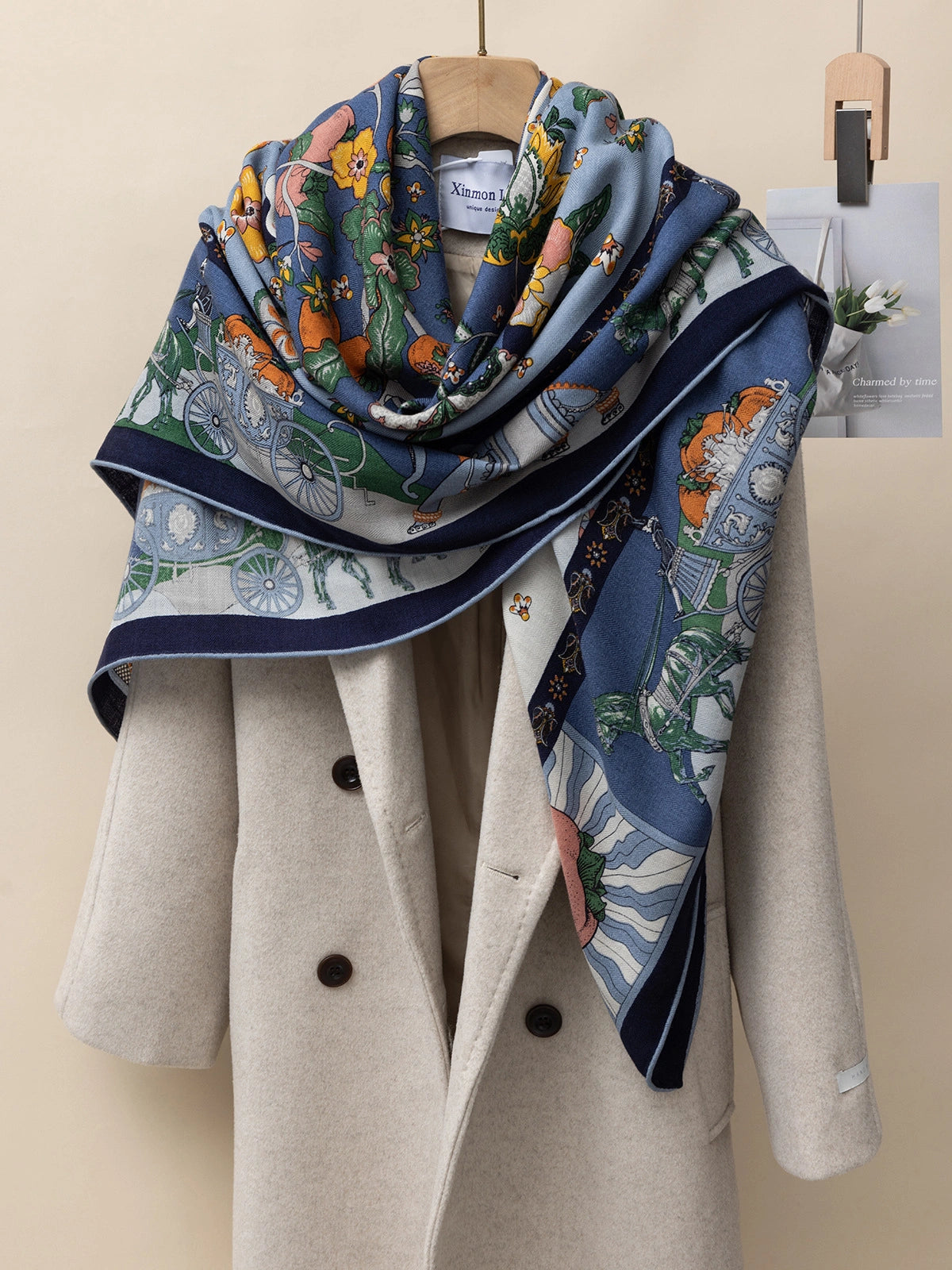 Silk wool scarf - Persimmon print | Blue, 130*130 cm, draped over a coat, showcasing luxurious texture.
