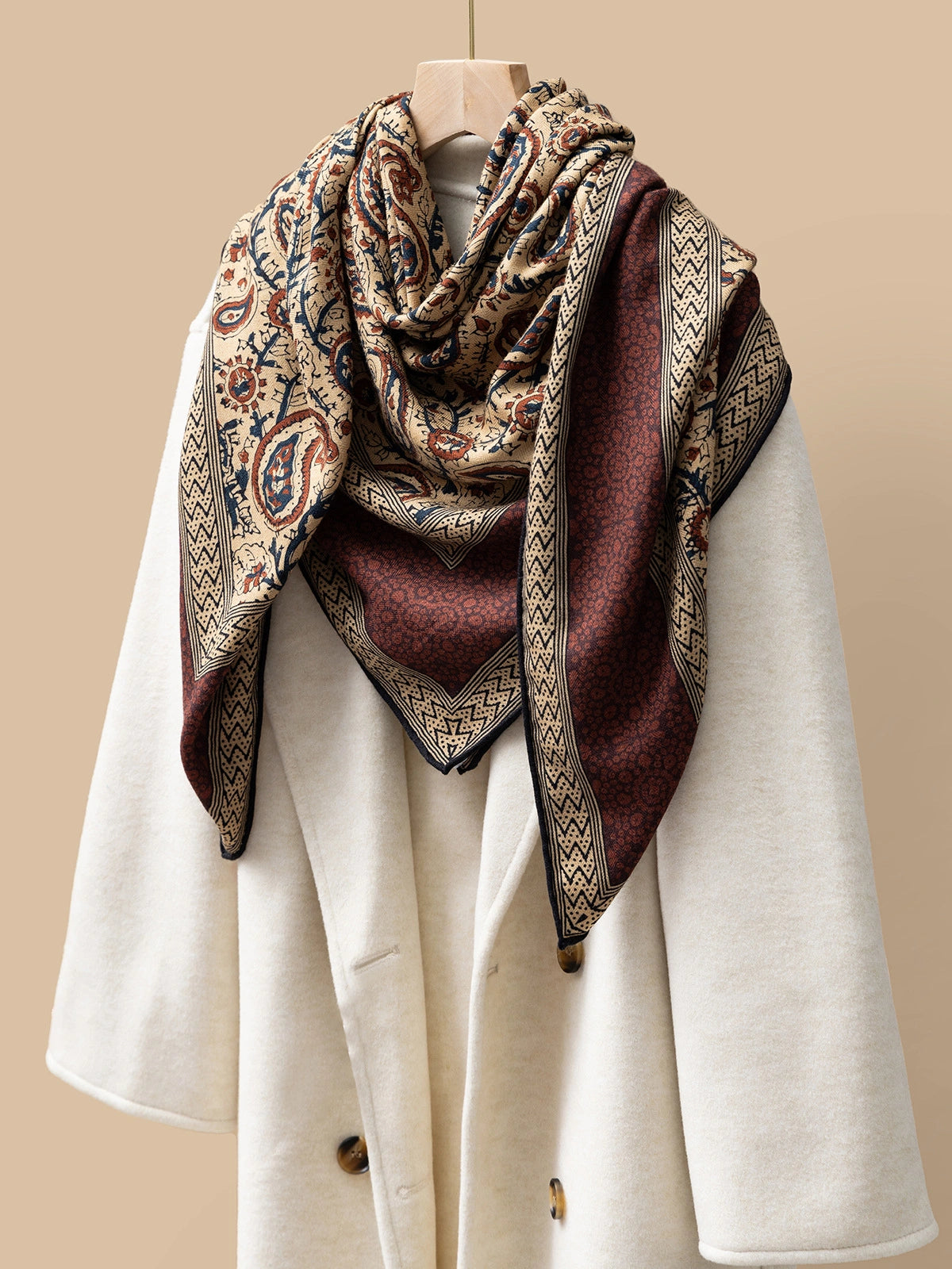 Silk Wool Square Scarf – Vintage Paisley Design | Brown, 130*130cm, draped on a coat, highlighting intricate paisley patterns, elegant fashion accessory.