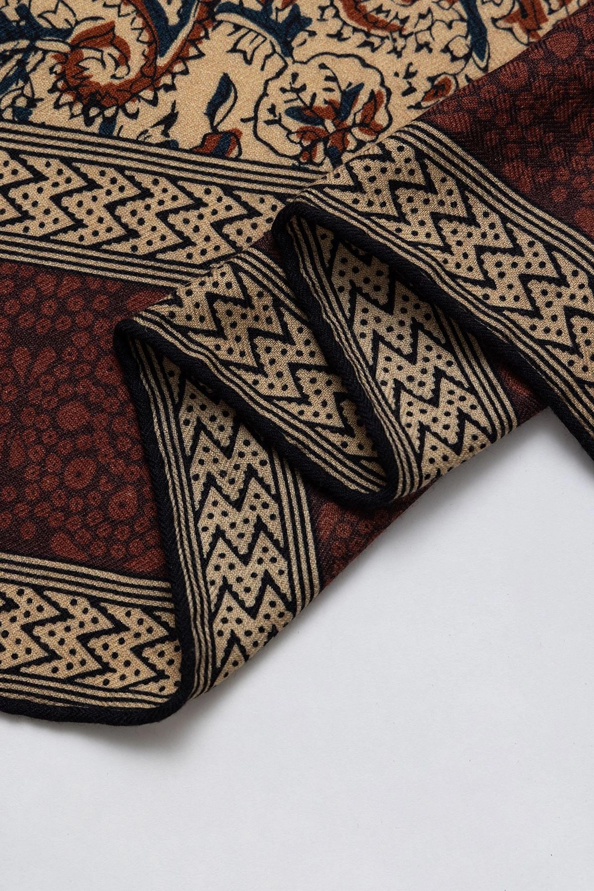 Silk Wool Square Scarf – Vintage Paisley Design | Brown, 130*130cm, close-up of edge, highlighting detailed paisley patterns, luxurious scarf.