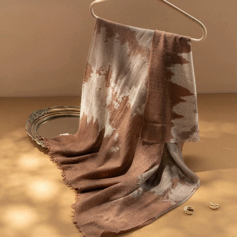 Close-up of the coffee brown cashmere scarf, highlighting its artistic design and premium quality.