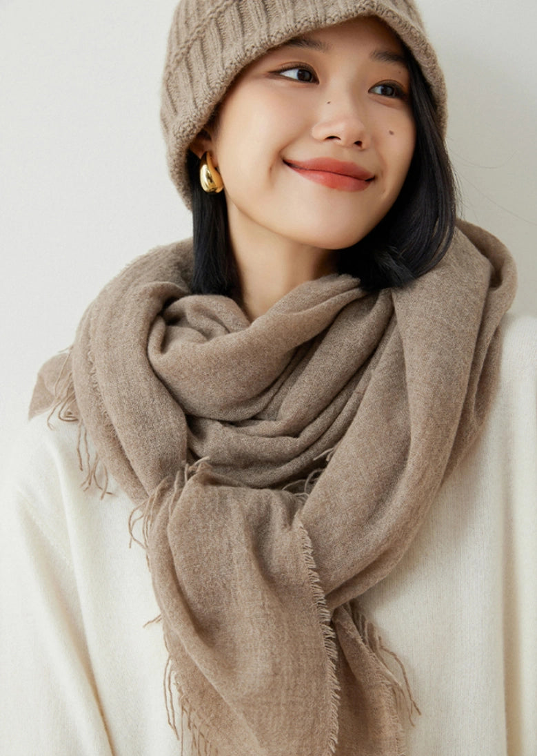 Mocha brown oversized cashmere scarf, styled for a sophisticated winter look.