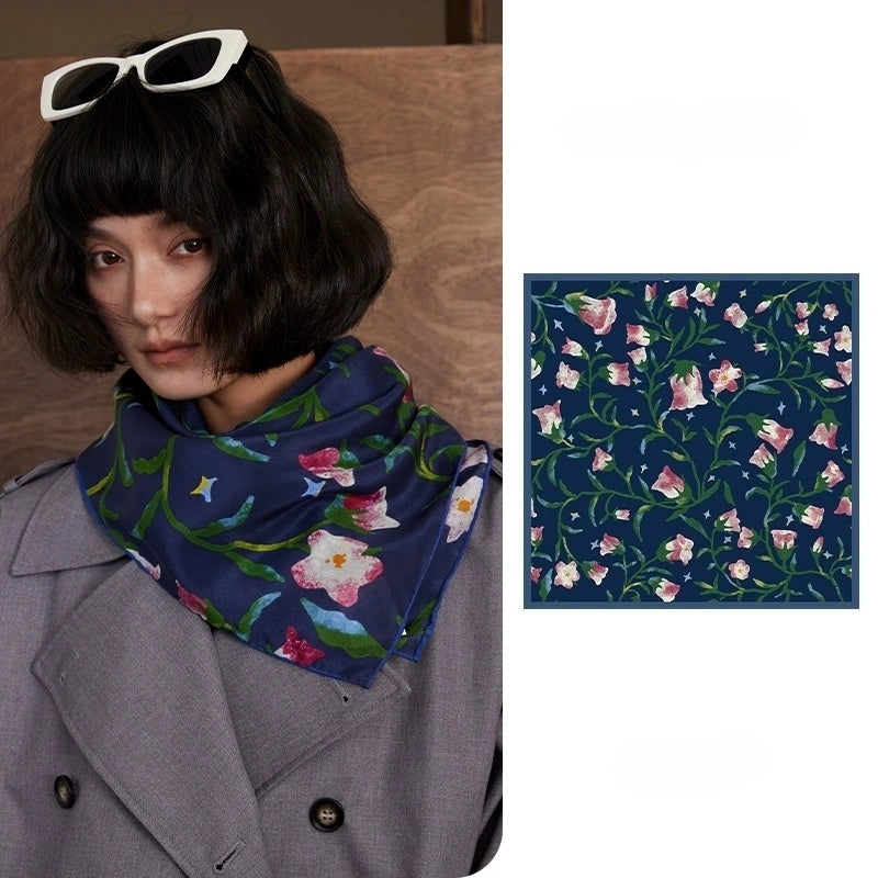Midnight Blue silk square scarf (63x63cm) laid flat, showcasing its intricate pink morning glory floral design on mulberry silk, displayed against a white background.