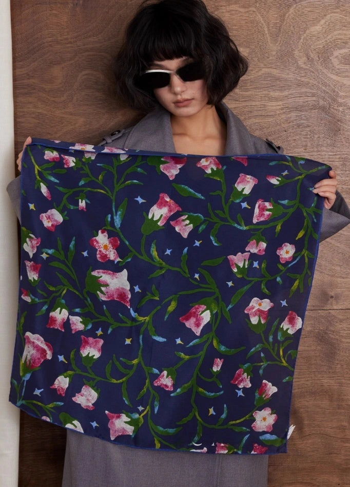 Midnight Blue silk square scarf with morning glory floral print, 100% mulberry silk, displayed flat to highlight its sophisticated design.