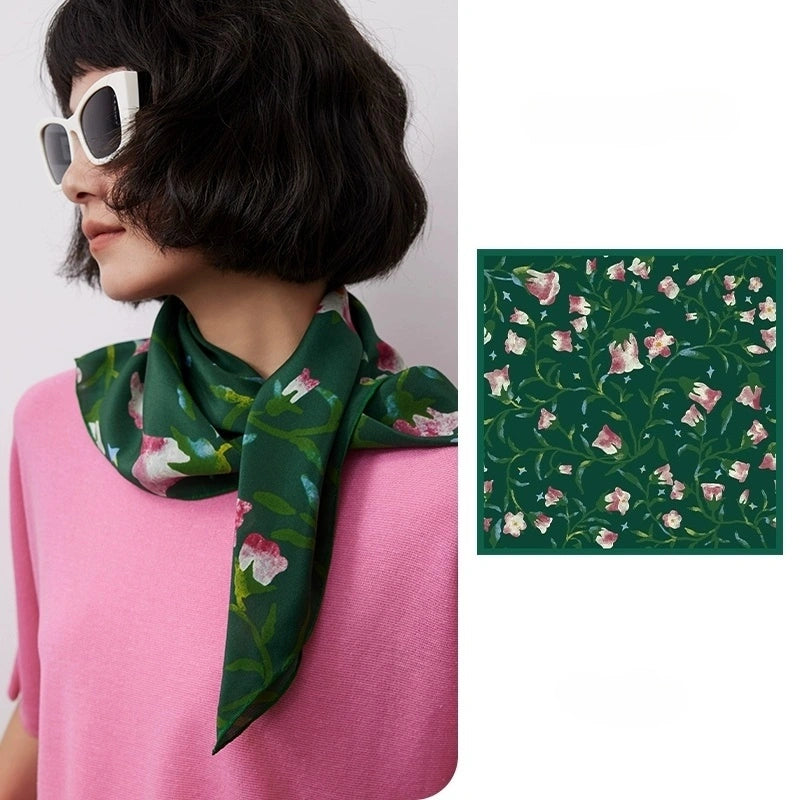 Wilderness Green silk square scarf with morning glory floral print, 100% mulberry silk, displayed flat to highlight its vibrant design.