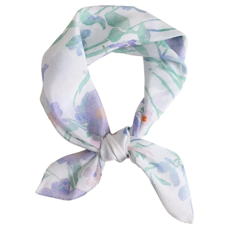 Square silk scarf with watercolor floral print, displayed flat on a white background.
